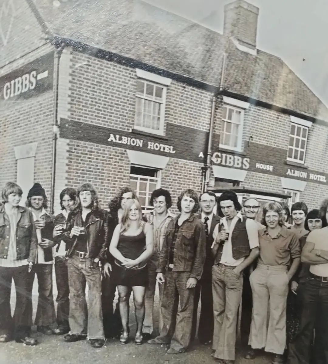 A crowd of regulars in flares and denim outside the Albion Hotel in the 1970s