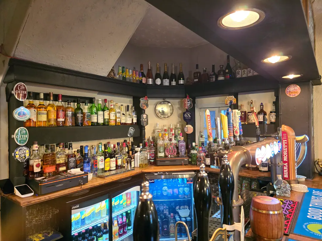 The back bar with spirits and chilled drinks