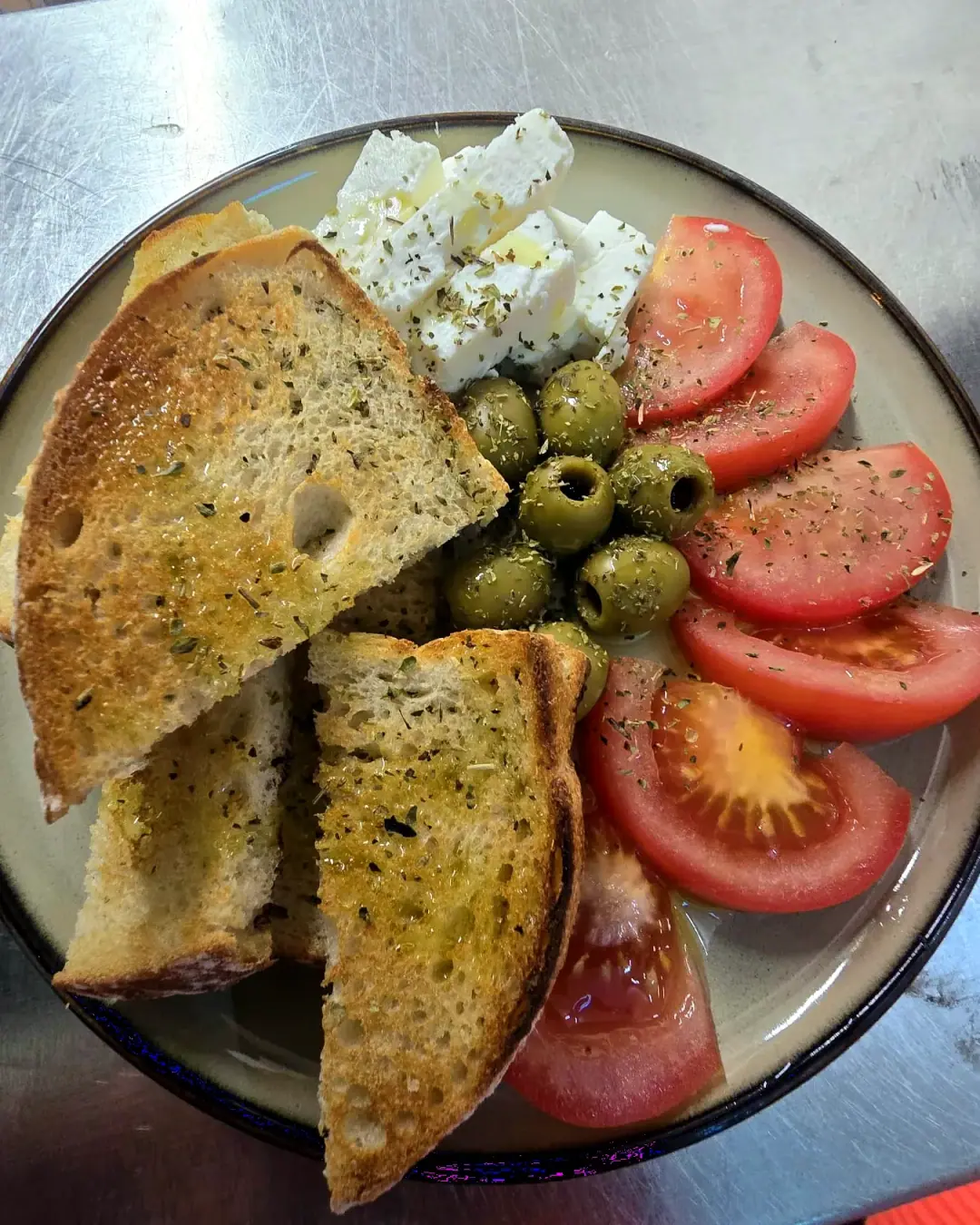 Feta, green olives and tomato with toasted sourdough